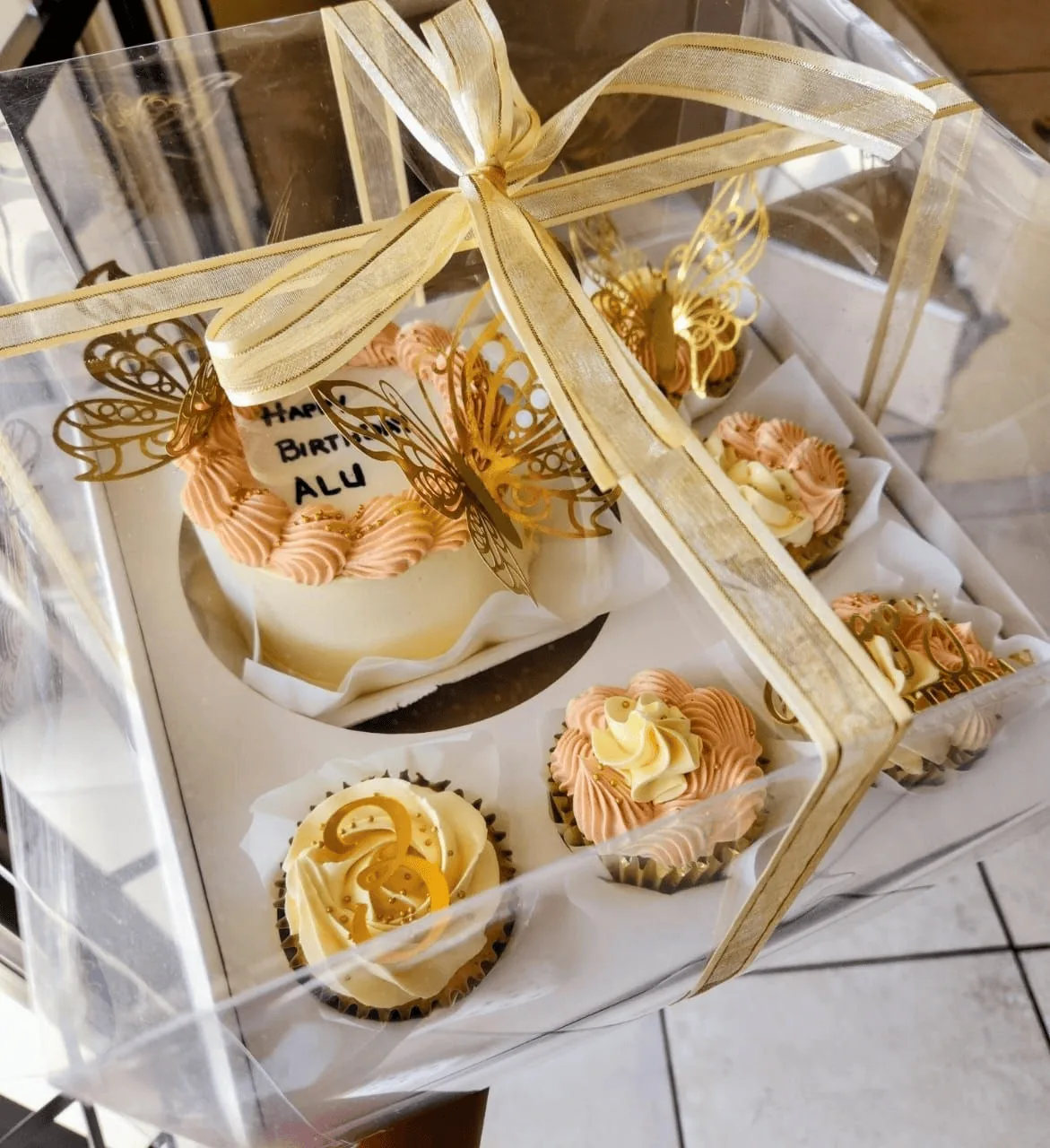 Birthday dessert treat box with mini pastries and ribbons